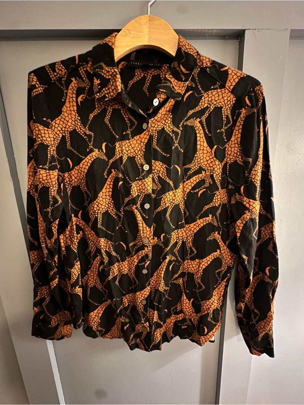 Women's Black and Orange Giraffe‎ Print Button-Up Shirt